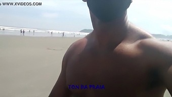 A Lot Of People On A Beach Stroll In The Morning